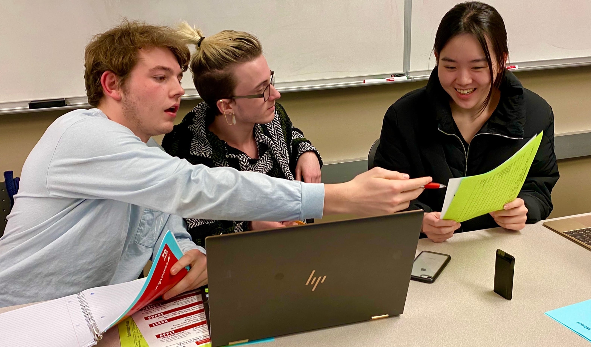 Three students participating in a virtual coding session